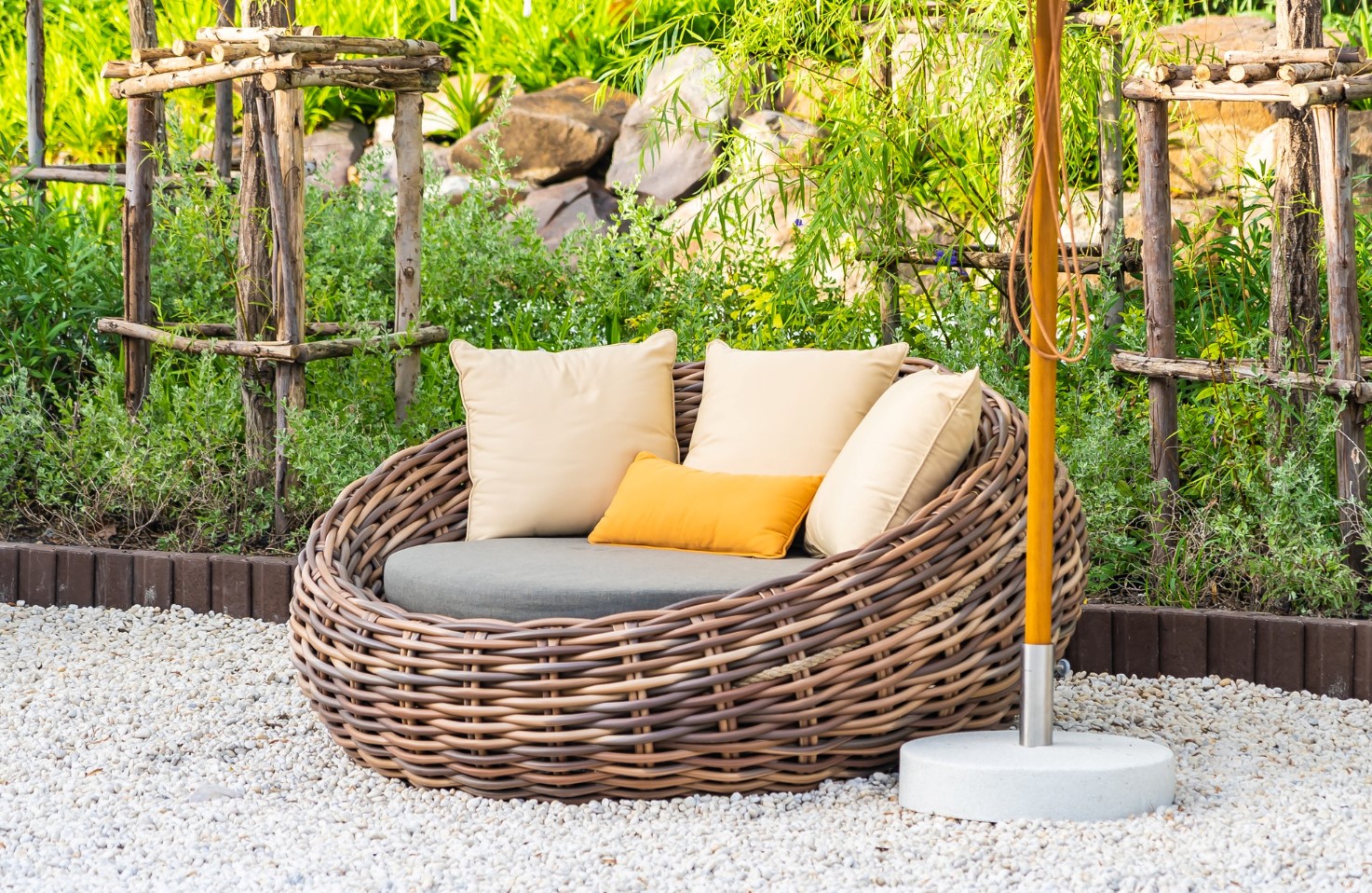 Image depicting outdoor waterproof cushions and outdoor furniture, designed to resist water, making them suitable for any condition.